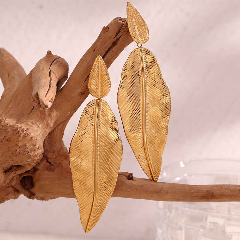 Gold spliced feather leaf earrings of different sizes